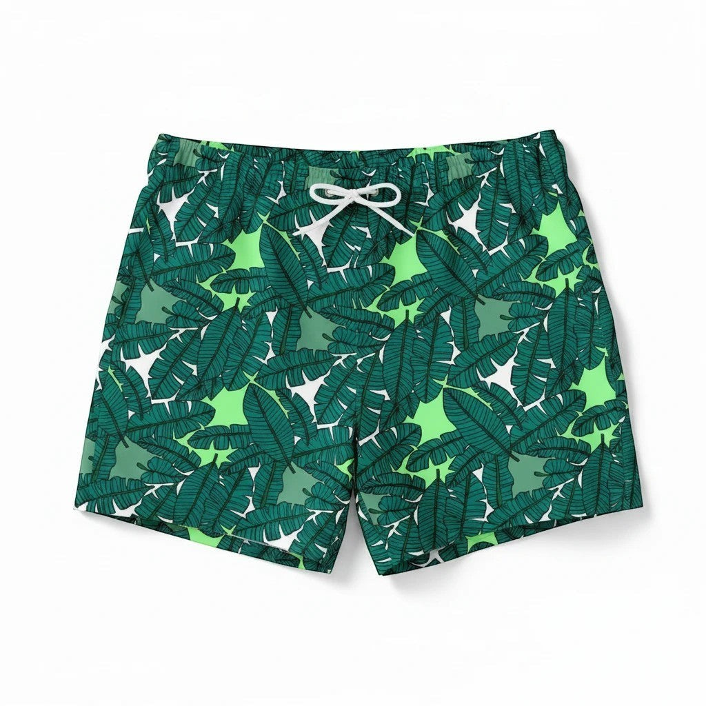 65mcmlxv Men's green banana leaf print swim trunks with white drawstring and mesh lining.