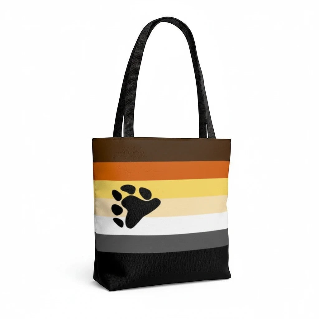65mcmlxv tote bag with bear pride flag print and black paw graphic. Made of polyester with black handles and lining.