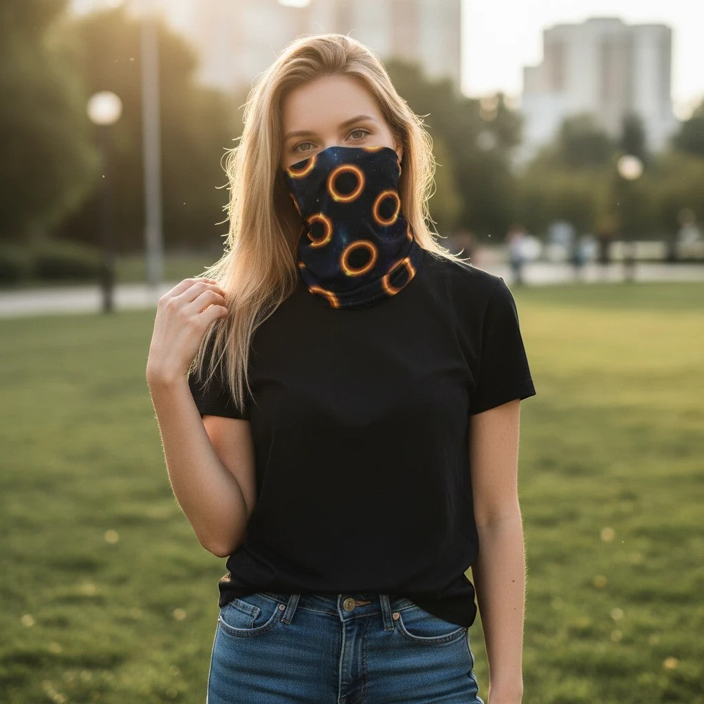 65mcmlxv black neck gaiter with solar eclipse polka dot pattern, polyester and lycra blend, one size fits most.