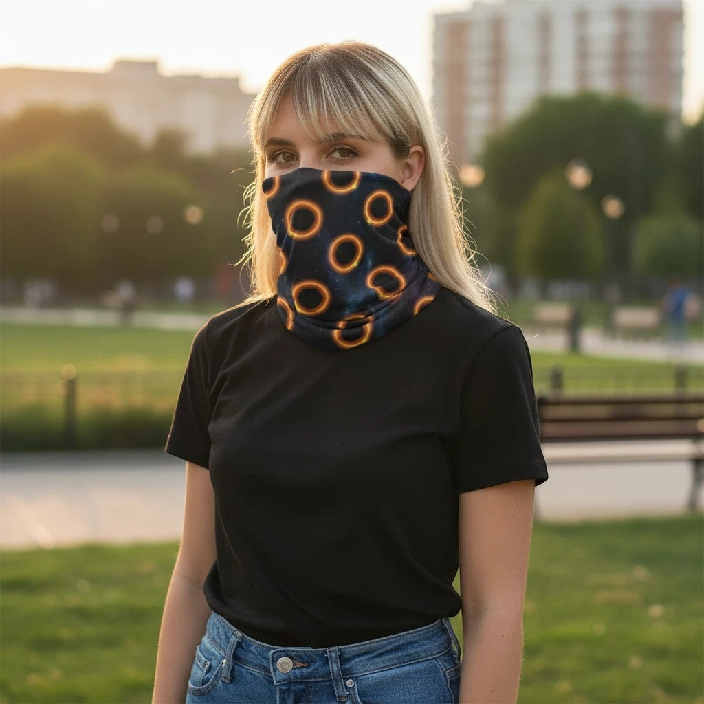 65mcmlxv black neck gaiter with solar eclipse polka dot pattern, polyester and lycra blend, one size fits most.