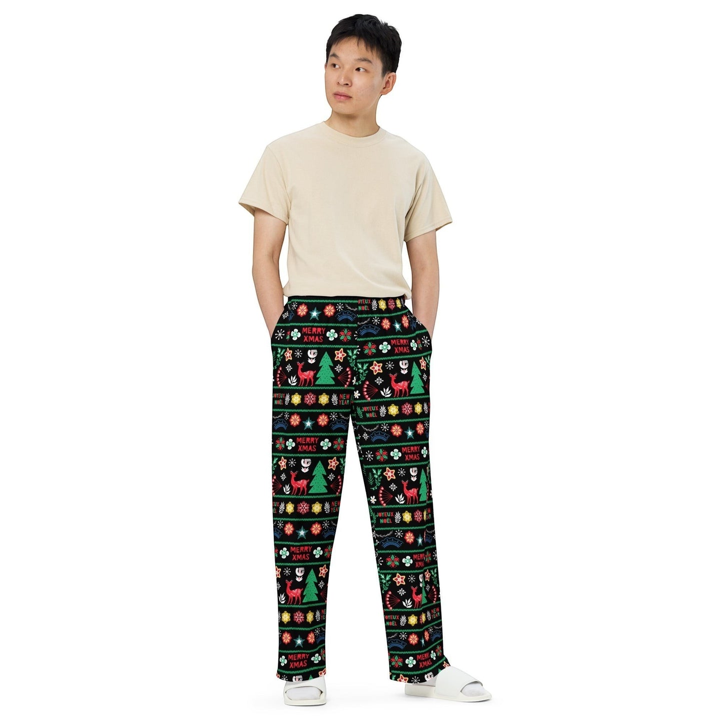 65mcmlxv unisex wide-leg lounge pants with a black background and a festive Scandinavian Nordic Christmas fairisle print featuring reindeer, Christmas trees, and snowflakes.