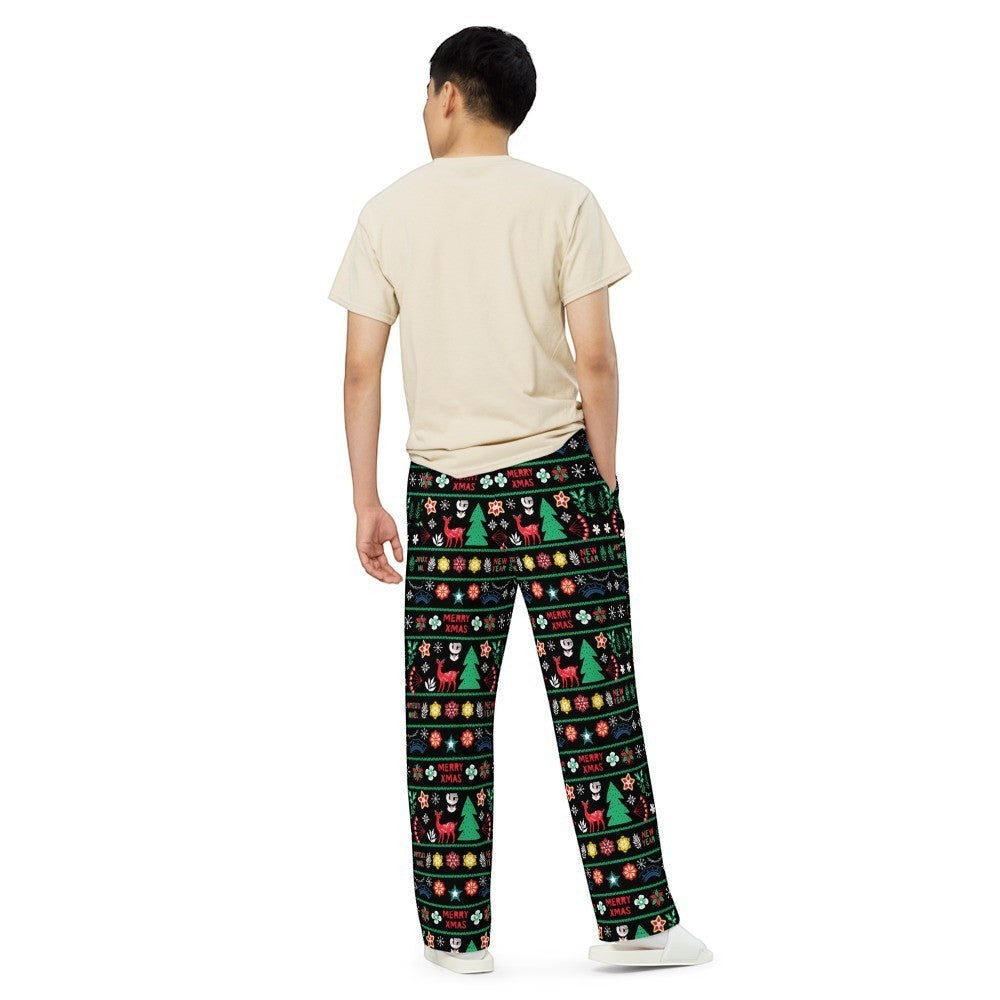 65mcmlxv unisex wide-leg lounge pants with a black background and a festive Scandinavian Nordic Christmas fairisle print featuring reindeer, trees, snowflakes, and "Merry Xmas" text.