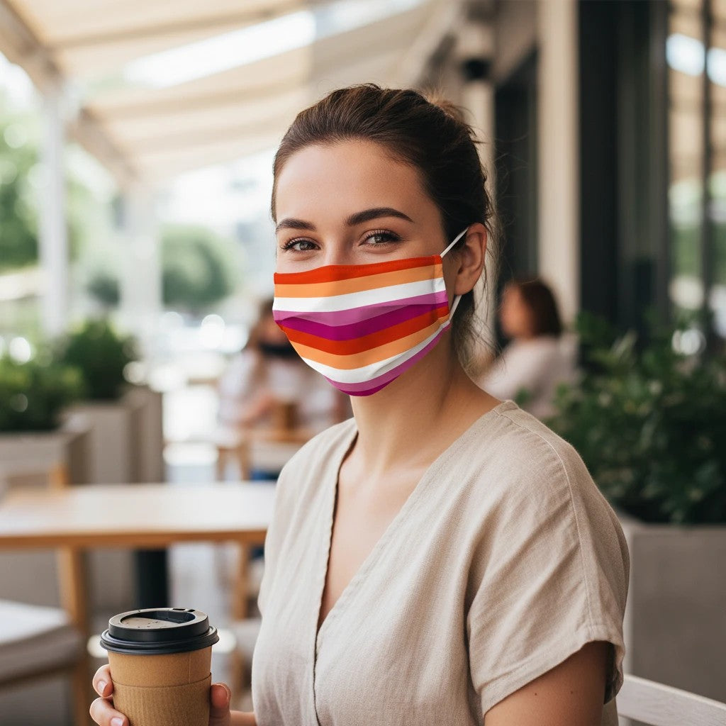 65 MCMLXV Lesbian Pride Sunset Flag Print Face Mask with adjustable ear loops and nose crimps. Polyester-Lycra blend.