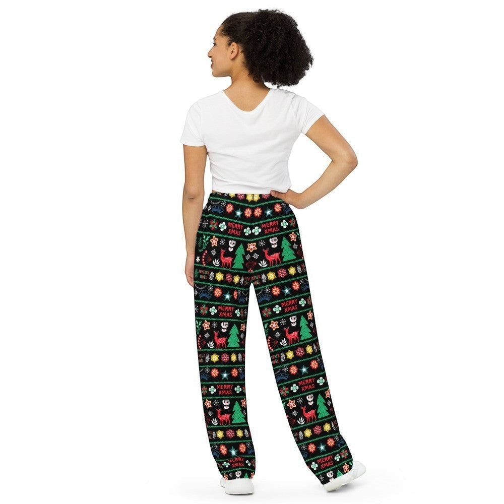 65mcmlxv black wide-leg lounge pants with a Scandinavian Nordic Christmas fairisle print featuring reindeer, trees, and "Merry Xmas" text.
