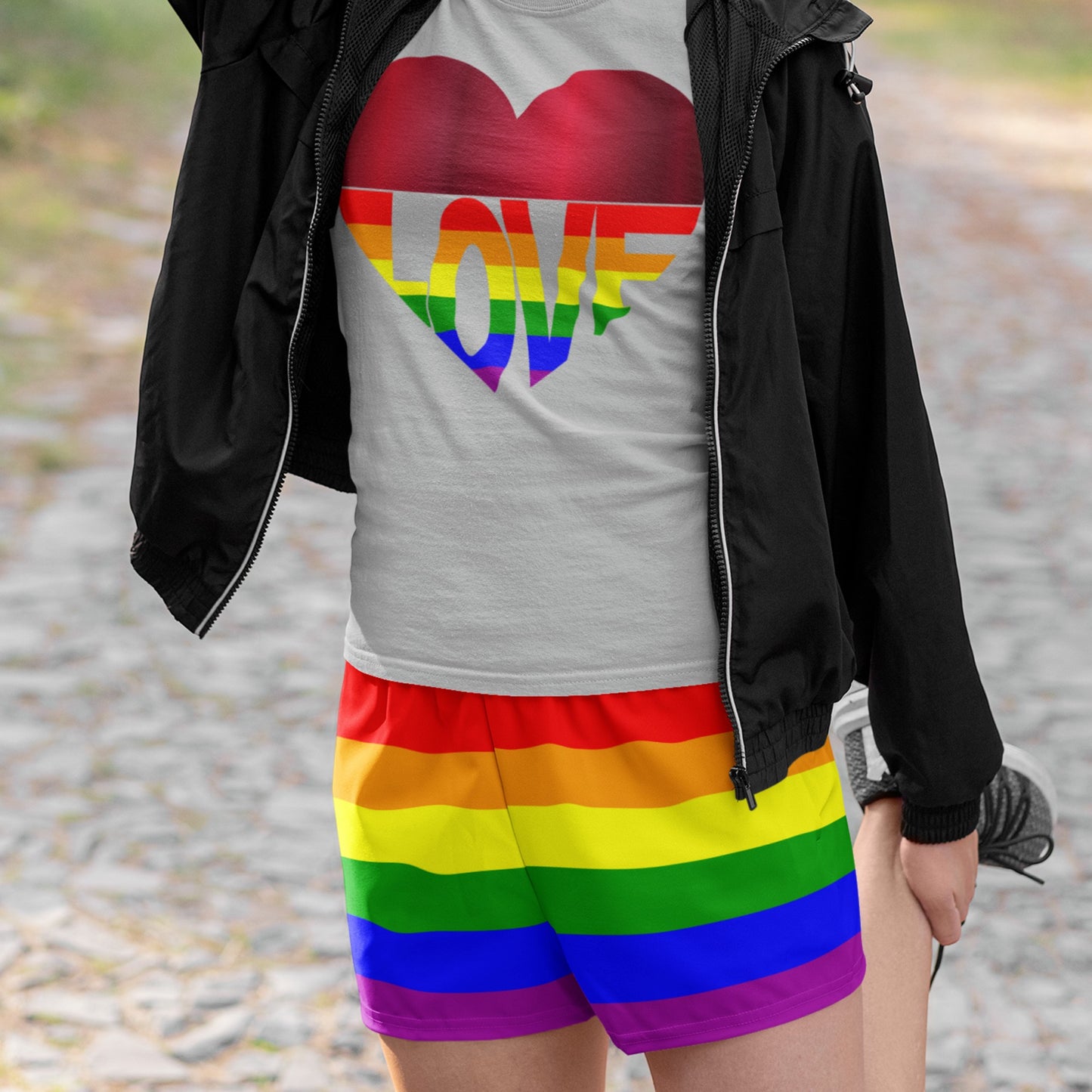 65mcmlxv women's rainbow striped athletic shorts with a high rise fit and drawstring closure.