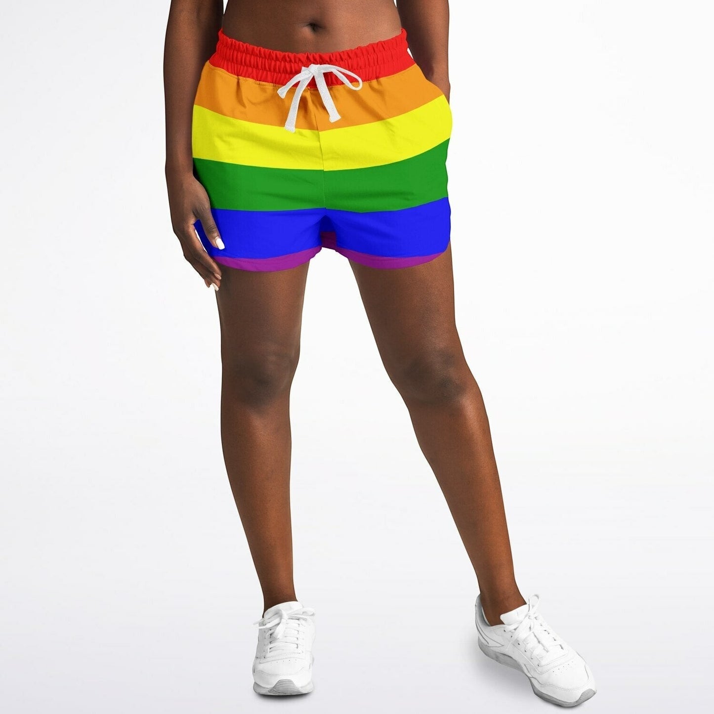 65mcmlxv women's rainbow flag athletic shorts with white drawstring and red waistband. Made of recycled polyester and spandex.