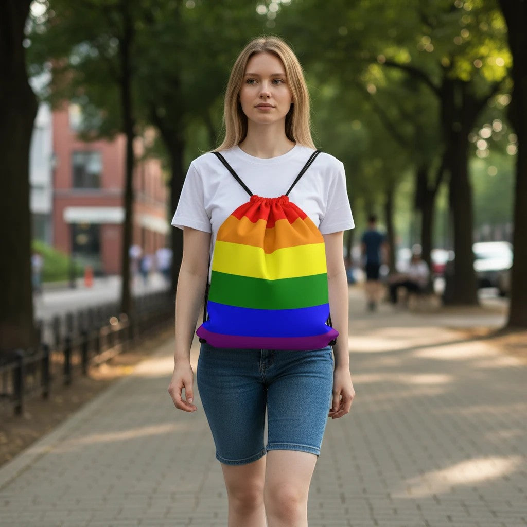 65mcmlxv rainbow flag print drawstring bag backpack made of spun polyester with twin cotton handles and drawstring closure.