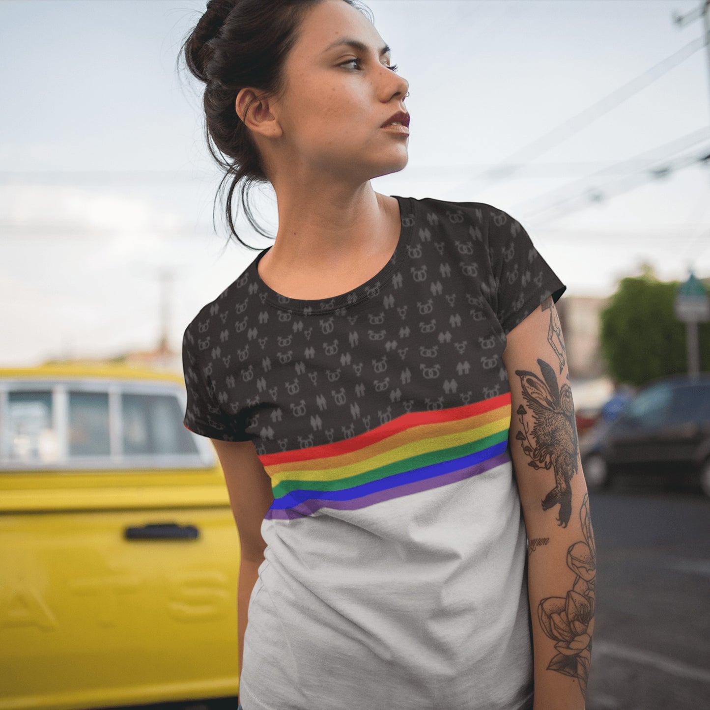 65mcmlxv Unisex t-shirt with rainbow stripe and subtle LGBT symbols on black upper half. White lower half.