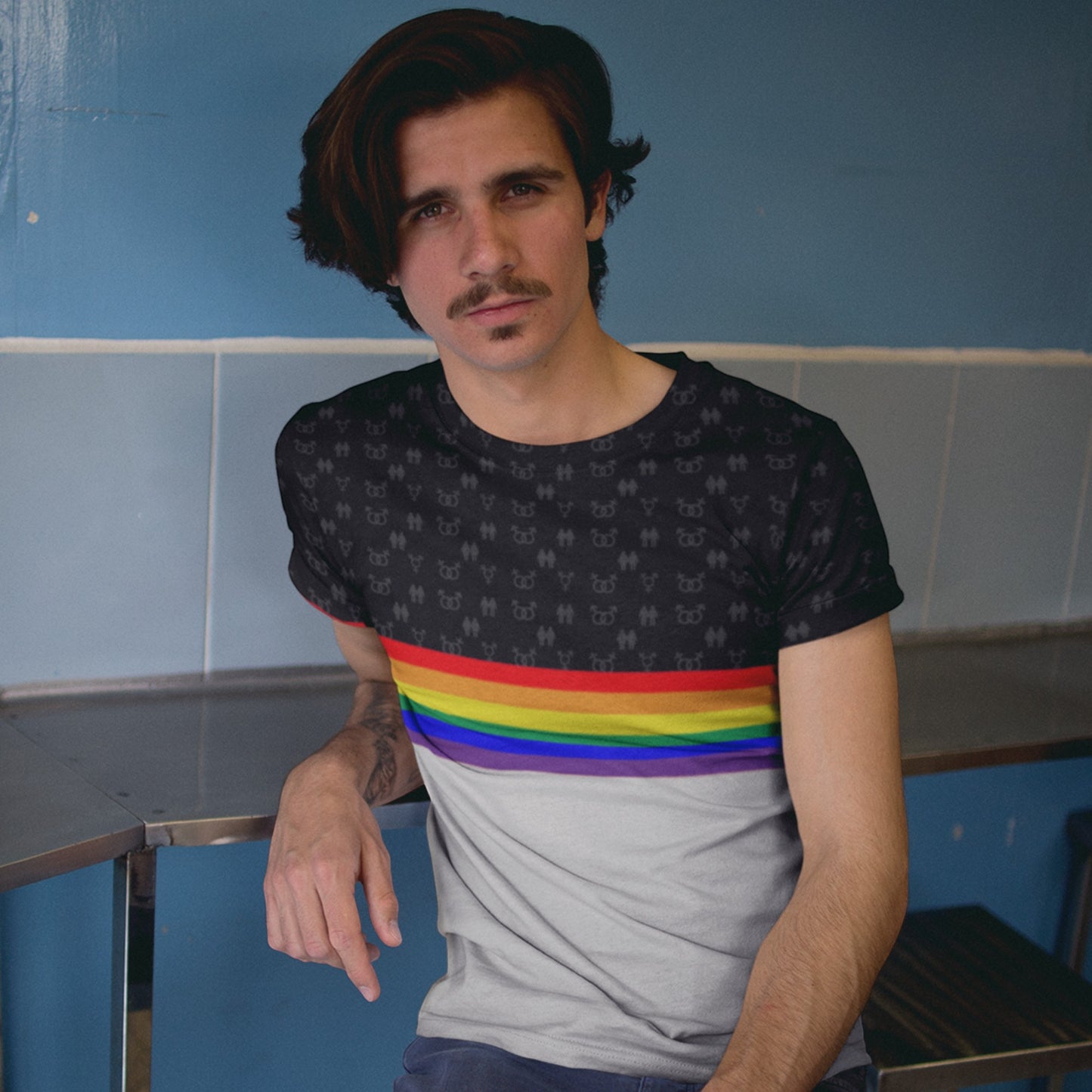 65mcmlxv unisex t-shirt with rainbow stripe print and subtle interlocking figures pattern on black upper chest.