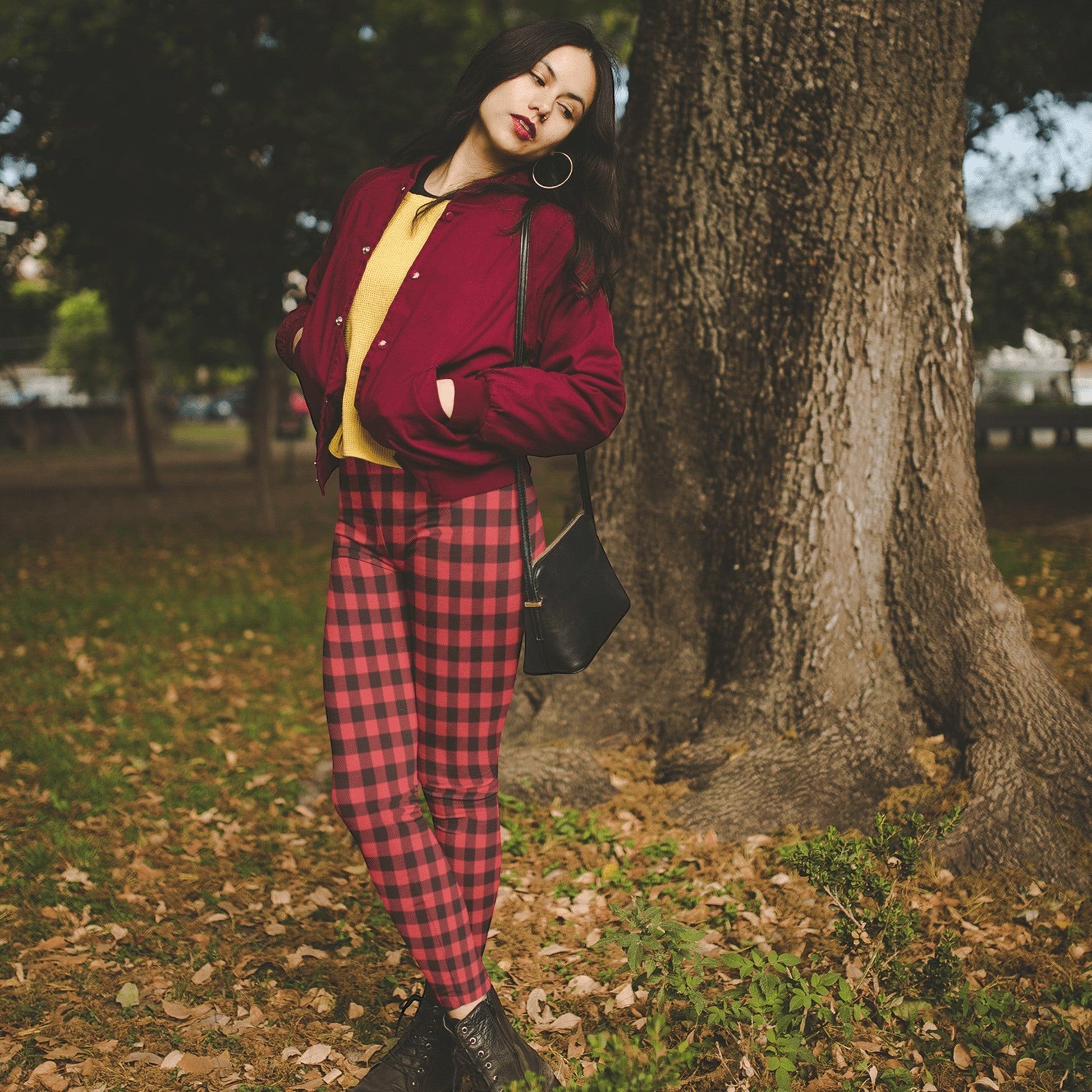 65 MCMLXV women's red and black buffalo plaid print leggings made from polyester and spandex with an elastic waistband.