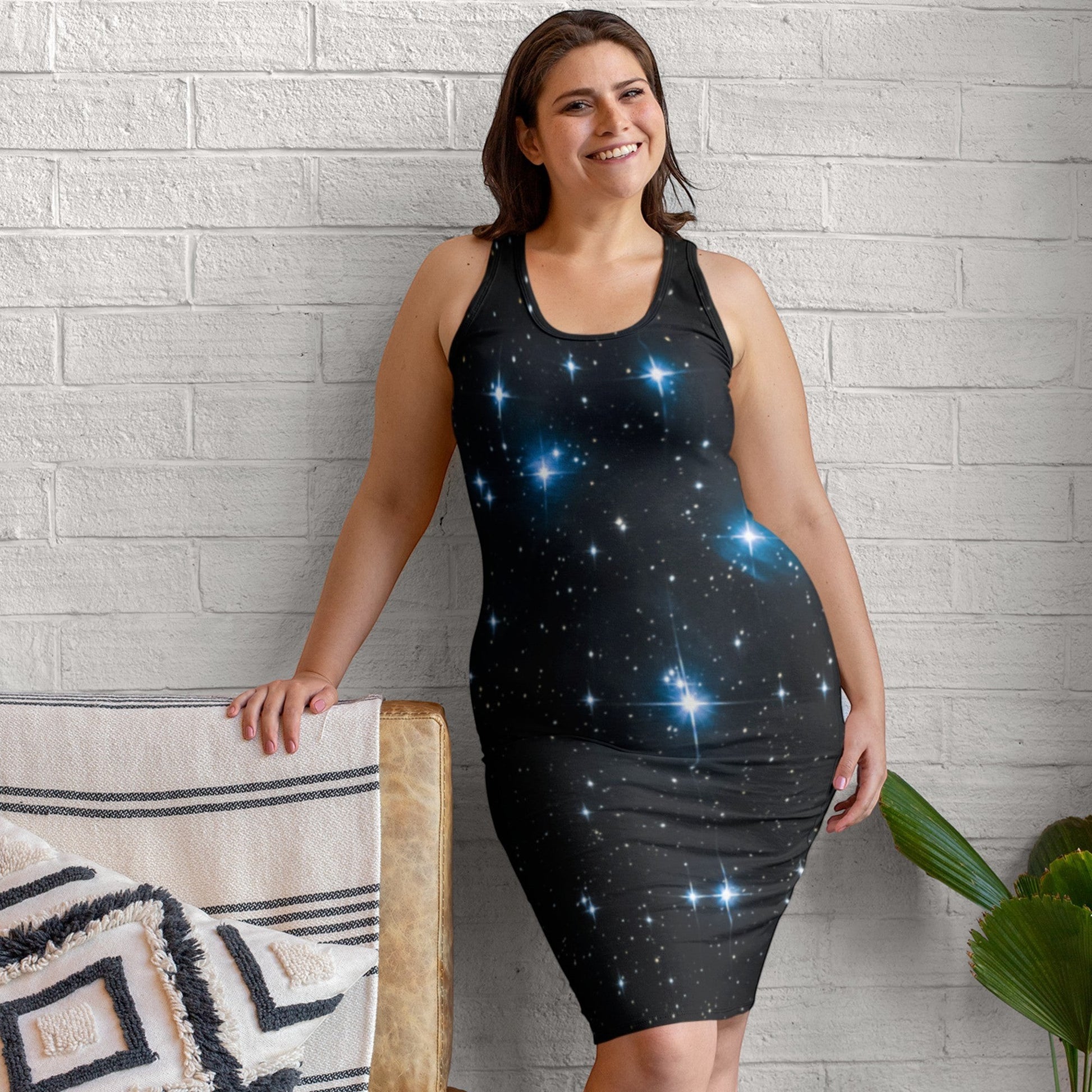65mcmlxv black sleeveless bodycon dress with a starry night print and blue glowing stars.
