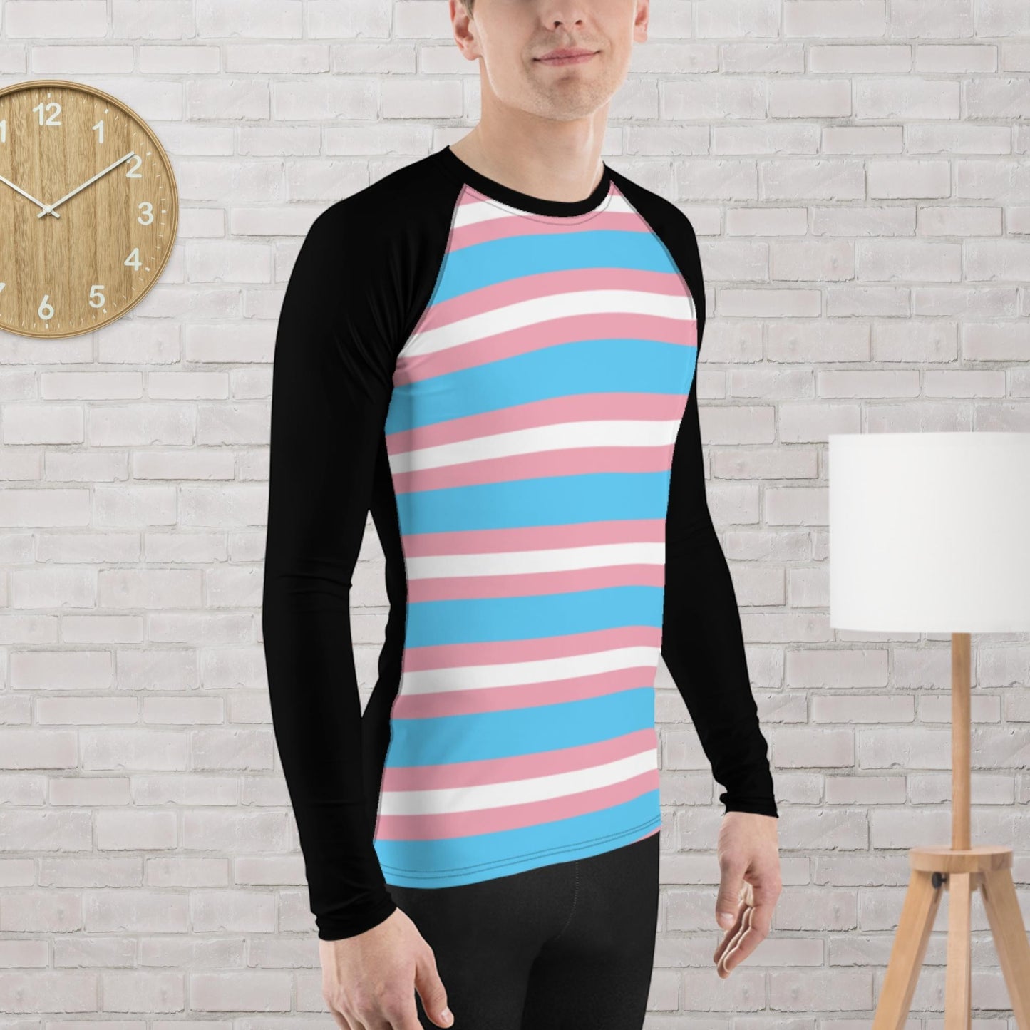 65mcmlxv Unisex transgender pride flag baseball long sleeve t-shirt with black sleeves and a striped torso in pink, white, and blue.