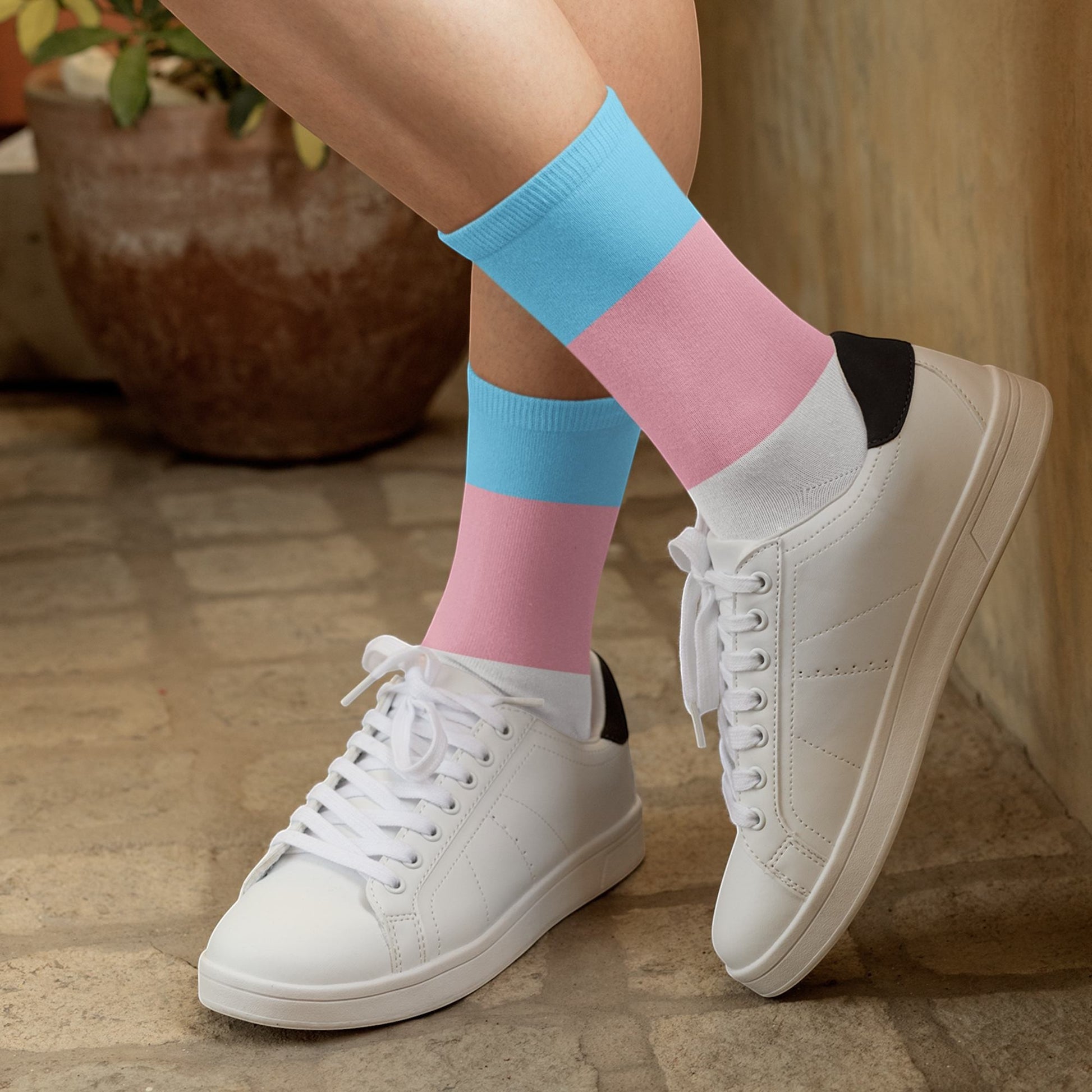 65mcmlxv Unisex socks with transgender pride flag colors: light blue, pink, and white. Polyester-spandex blend.