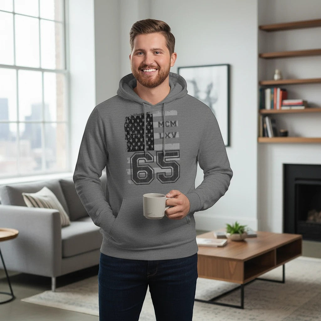 65 MCMLXV unisex heather grey pullover hoodie with distressed USA flag graphic and "65" graphic. 100% cotton.