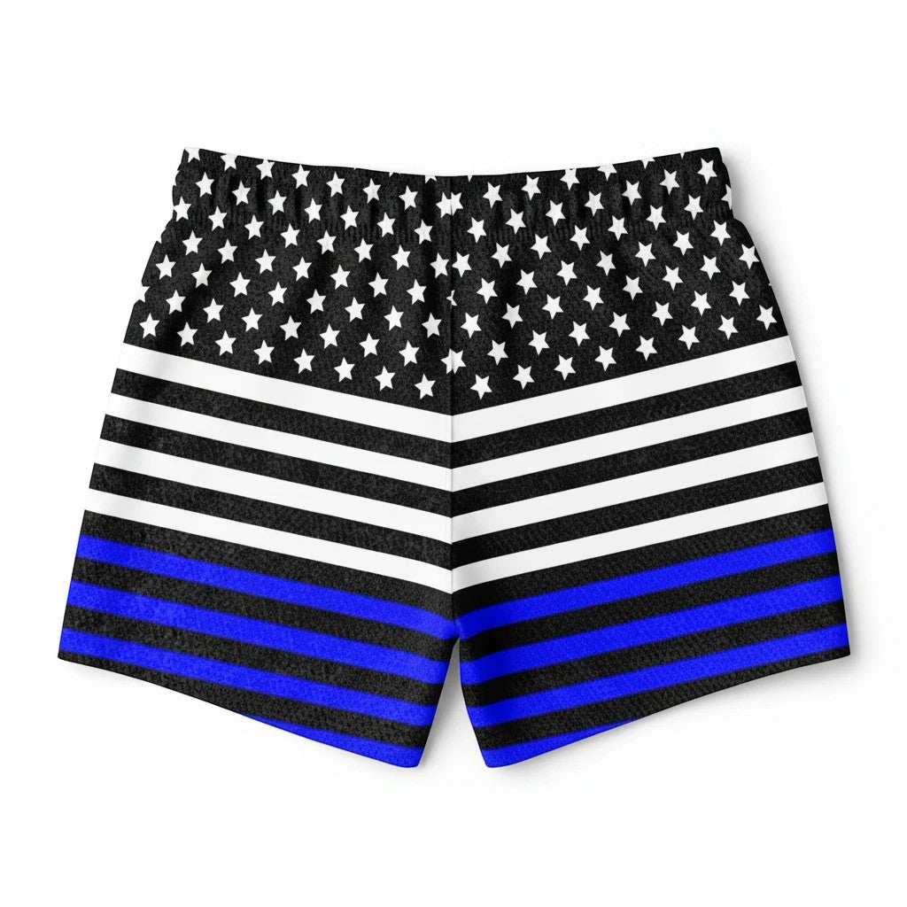 65mcmlxv Men's USA flag print swim trunks with blue line detail. Above-the-knee length, polyester twill.